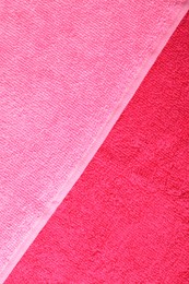 Photo of Bright terry towels as background, top view