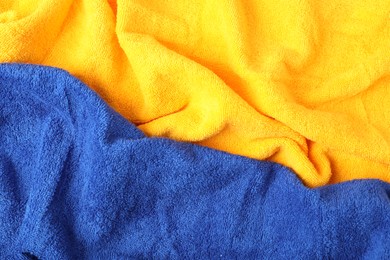Photo of Bright terry towels as background, top view