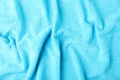 Photo of Light blue terry towel as background, top view