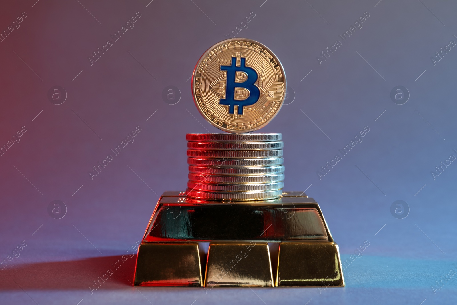 Photo of Bitcoins and gold bars on color background in red light, closeup