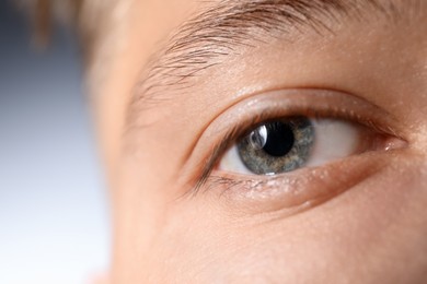 Photo of Man with beautiful eyes on light grey background, closeup