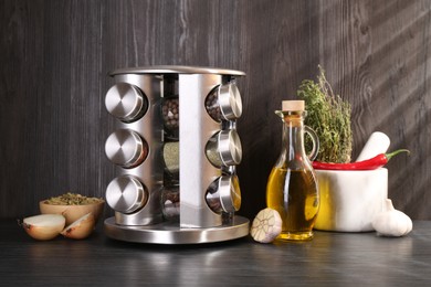 Photo of Set of jars with different spices on grey wooden table