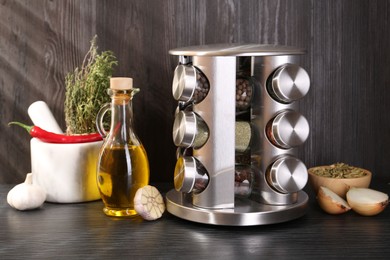 Photo of Set of jars with different spices on grey wooden table