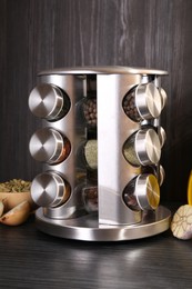 Photo of Set of jars with different spices on grey wooden table