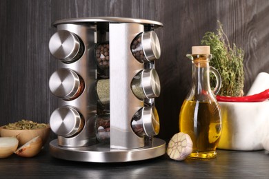 Photo of Set of jars with different spices on grey wooden table