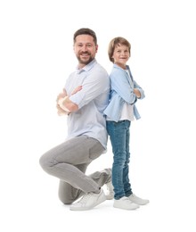 Photo of Father and son posing on white background