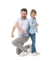 Photo of Father and son showing biceps on white background