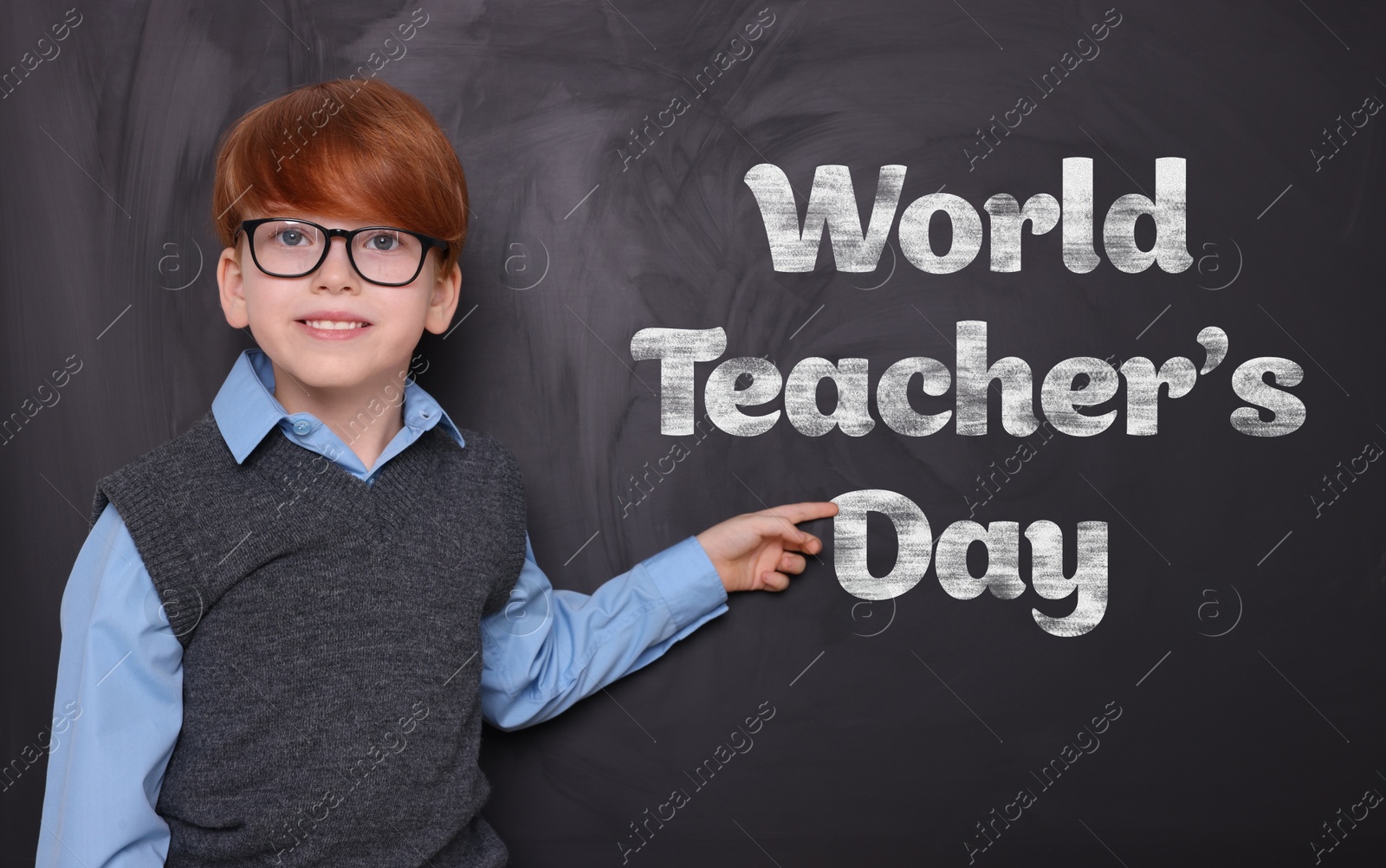 Image of Happy Teacher's Day. Cute little boy with eyeglasses near blackboard