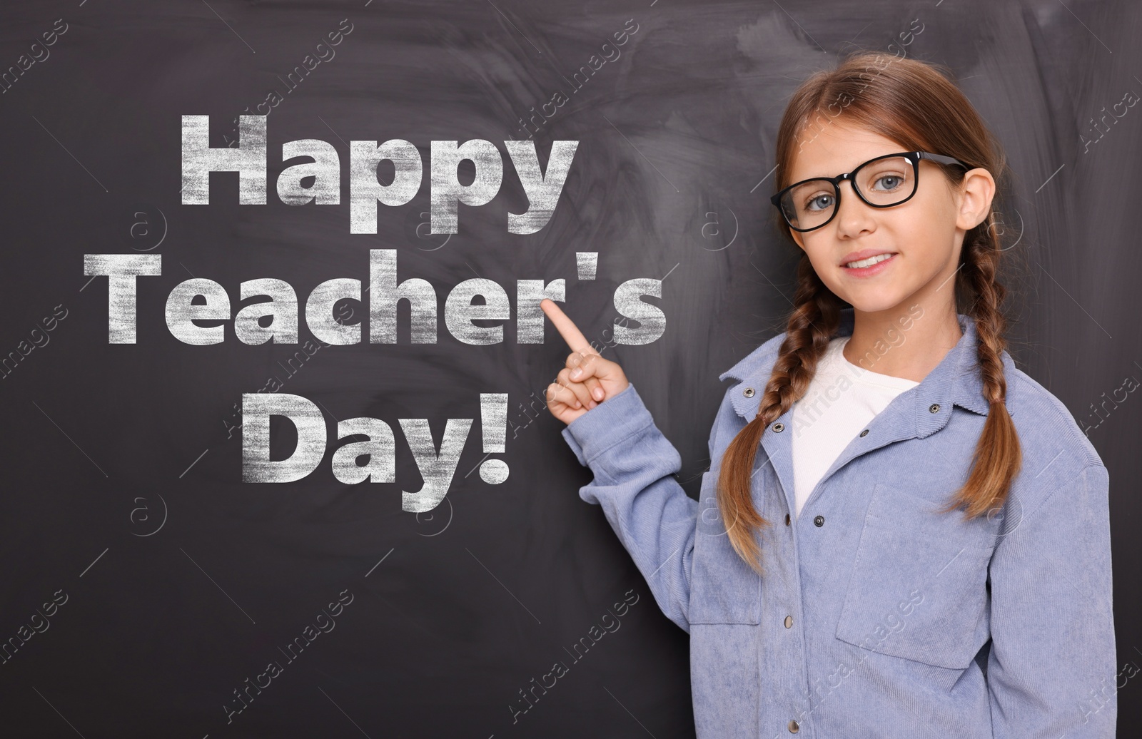 Happy Teacher's Day. Cute little girl with eyeglasses near blackboard Image of Happy Teacher's Day. Cute little girl with eyeglasses near blackboard