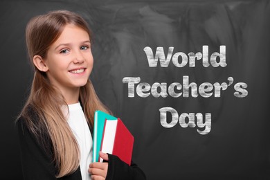 Image of Happy Teacher's Day. Cute little girl near blackboard