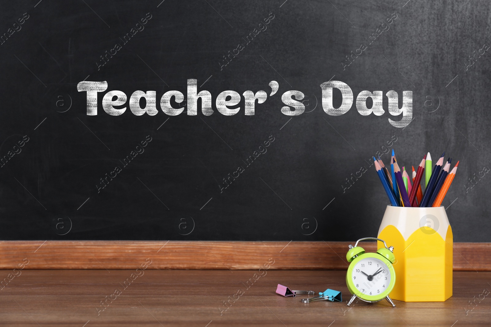 Image of Happy Teacher's Day greeting card. Blackboard with text and stationery