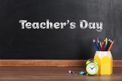 Image of Happy Teacher's Day greeting card. Blackboard with text and stationery
