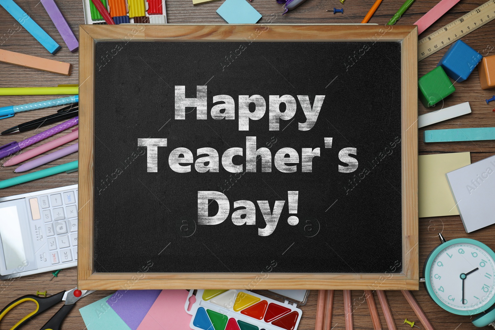 Image of Happy Teacher's Day greeting card. Small chalkboard with text and stationery