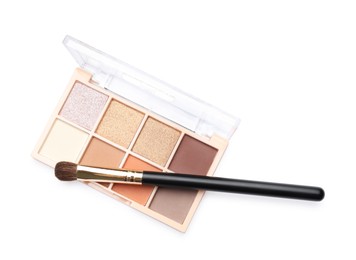 Photo of Beautiful eyeshadow palette with brush isolated on white, top view