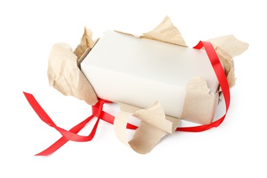 Photo of One unwrapped gift box isolated on white