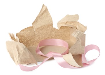 Photo of Torn wrapping paper and ribbon isolated on white