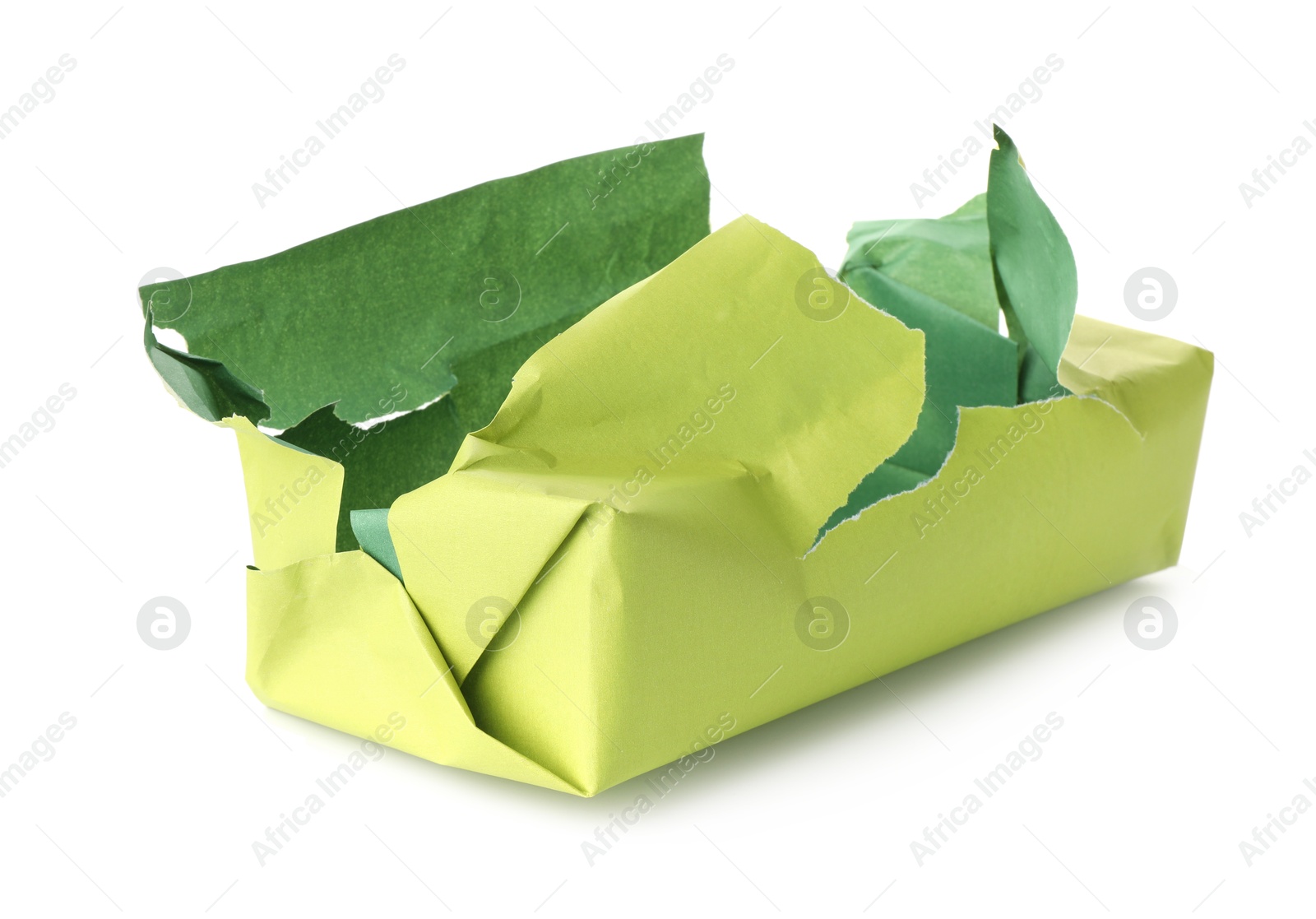 Photo of Opening gift. Torn wrapping paper isolated on white