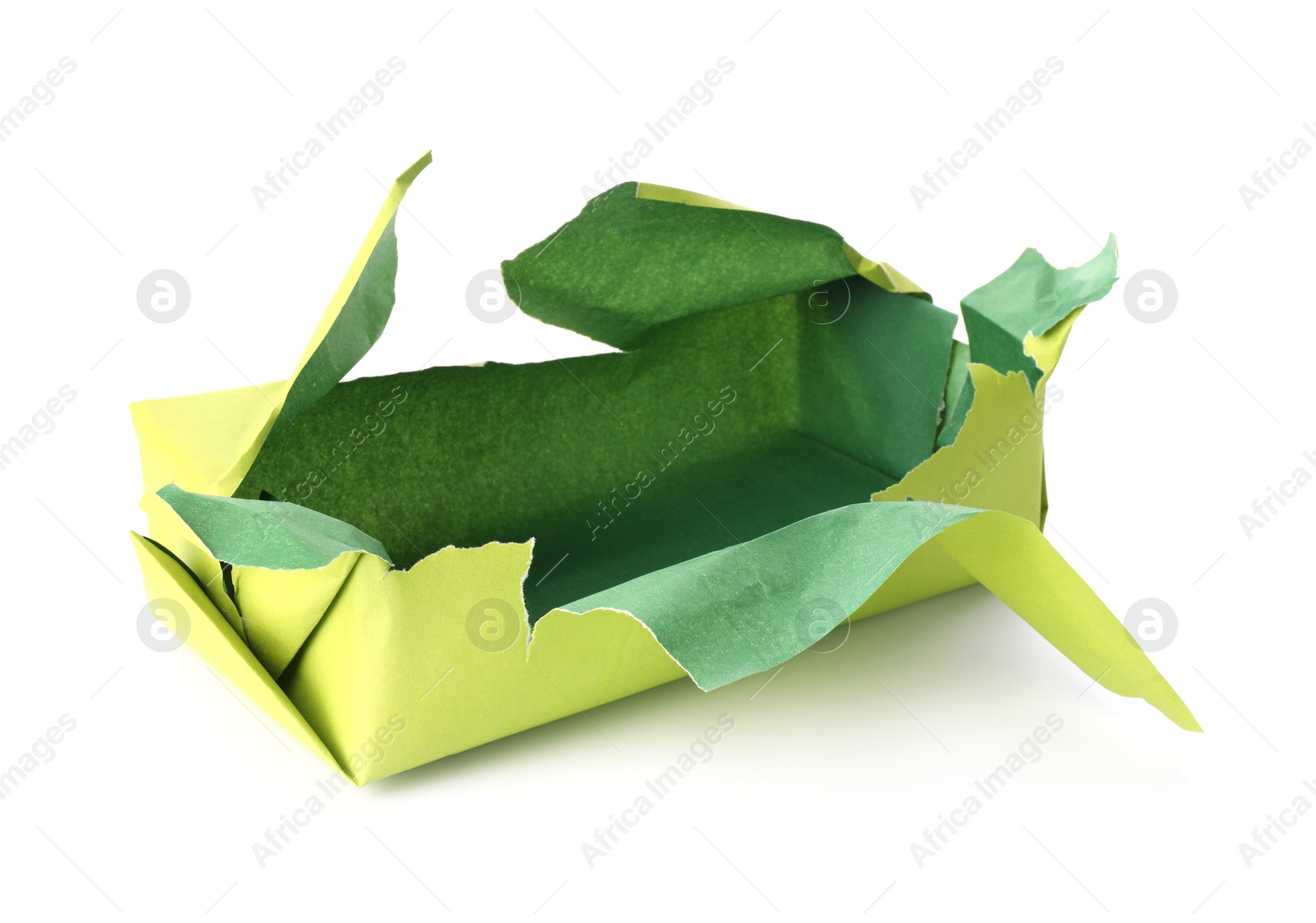 Photo of Opening gift. Torn wrapping paper isolated on white