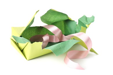 Photo of Torn wrapping paper and ribbon isolated on white