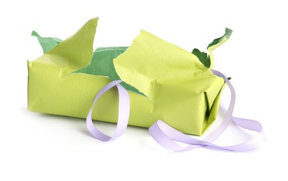 Photo of Torn wrapping paper and ribbon isolated on white