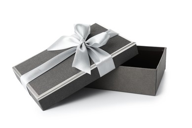 Photo of Open gift box with beautiful lid isolated on white