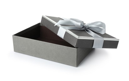 Photo of Open gift box with beautiful lid isolated on white