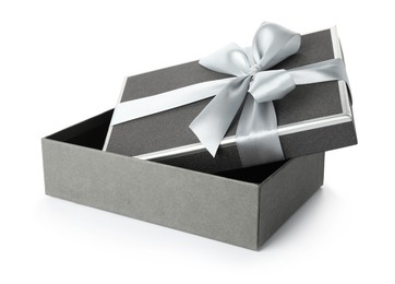 Photo of Open gift box with beautiful lid isolated on white