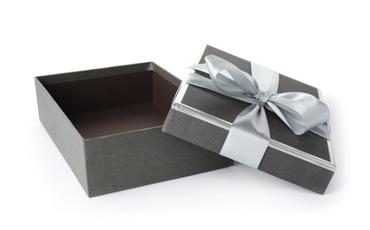 Photo of Open gift box with beautiful lid isolated on white