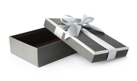 Photo of Open gift box with beautiful lid isolated on white
