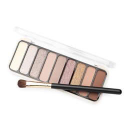 Photo of Beautiful eyeshadow palette with brush isolated on white, top view
