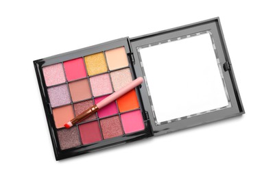 Photo of Beautiful eyeshadow palette with brush isolated on white, top view
