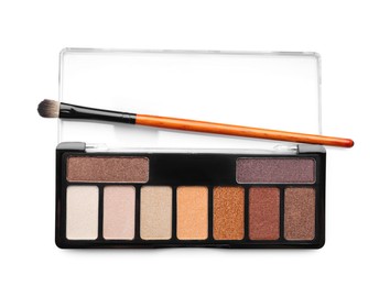 Photo of Beautiful eyeshadow palette with brush isolated on white, top view