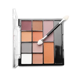Photo of Beautiful eyeshadow palette with applicator isolated on white, top view