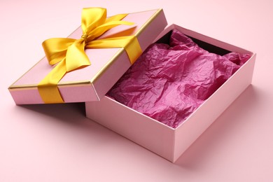Photo of Open gift box with beautiful lid on pink background