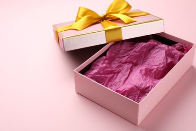 Photo of Open gift box with beautiful lid on pink background
