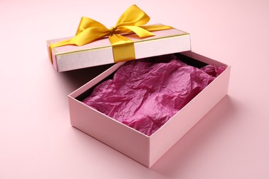 Photo of Open gift box with beautiful lid on pink background