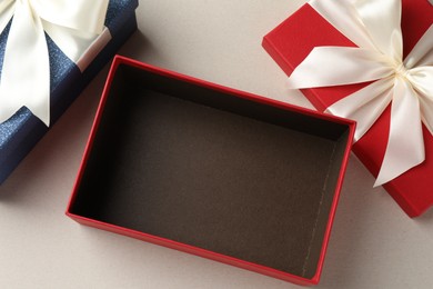 Photo of Beautiful color gift boxes on light background, flat lay