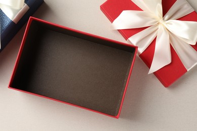 Photo of Beautiful color gift boxes on light background, flat lay