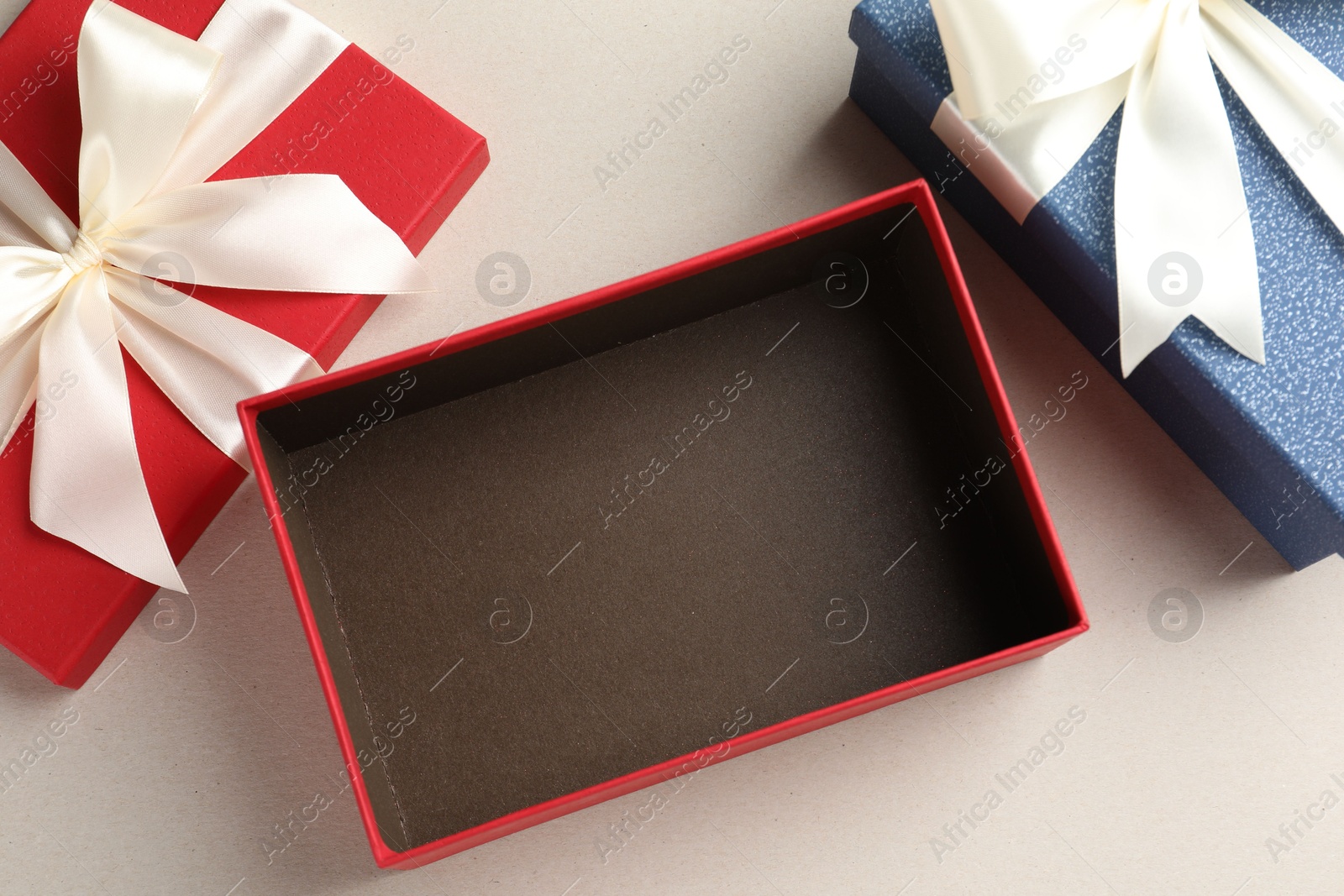 Photo of Beautiful color gift boxes on light background, flat lay