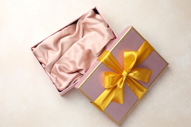 Photo of Open gift box with beautiful lid on light background, top view
