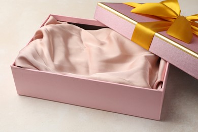 Photo of Open gift box with beautiful lid on light background