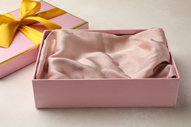 Photo of Open gift box with beautiful lid on light background