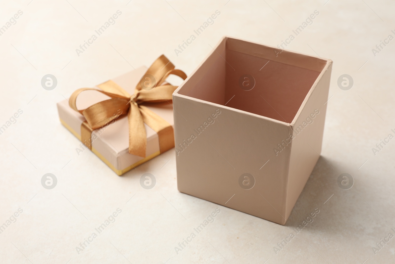 Photo of Open gift box with beautiful lid on light background