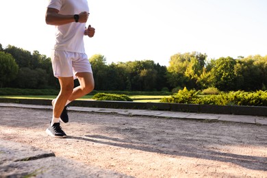 Photo of Man in stylish sneakers outdoors, closeup. Space for text