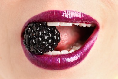 Photo of Woman with beautiful lips makeup and blackberry, closeup