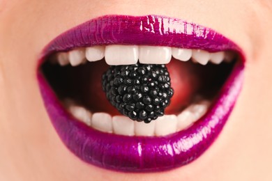 Photo of Woman with beautiful lips makeup and blackberry, closeup