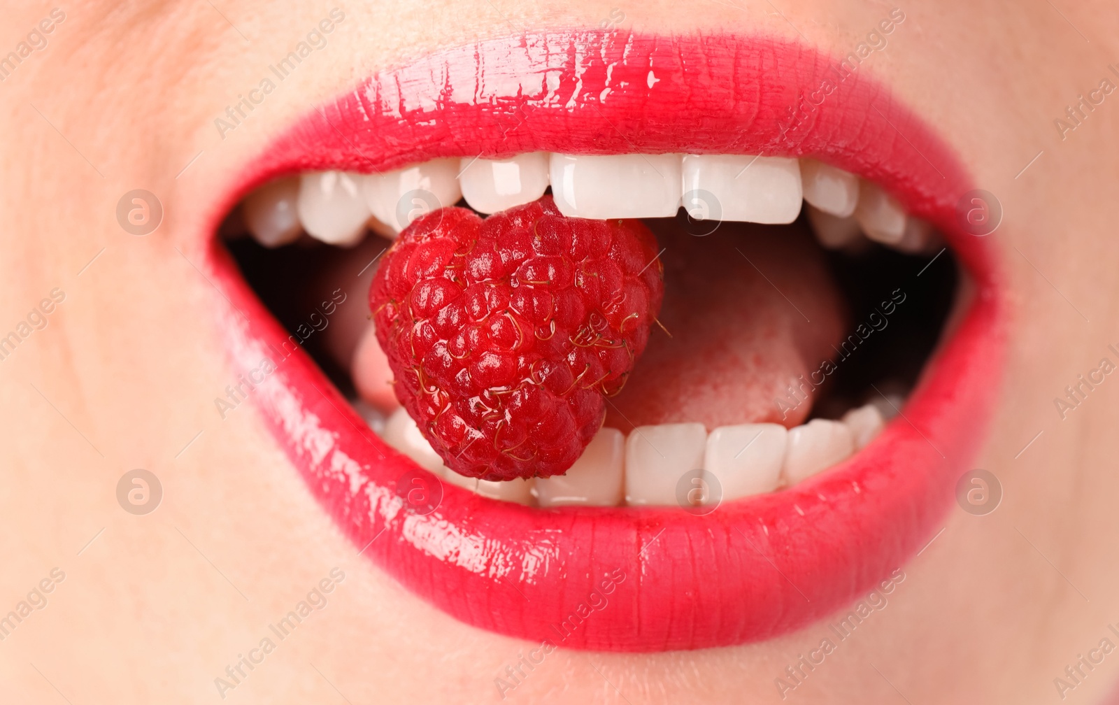 Woman with beautiful lips makeup and raspberry, closeup Photo of Woman with beautiful lips makeup and raspberry, closeup
