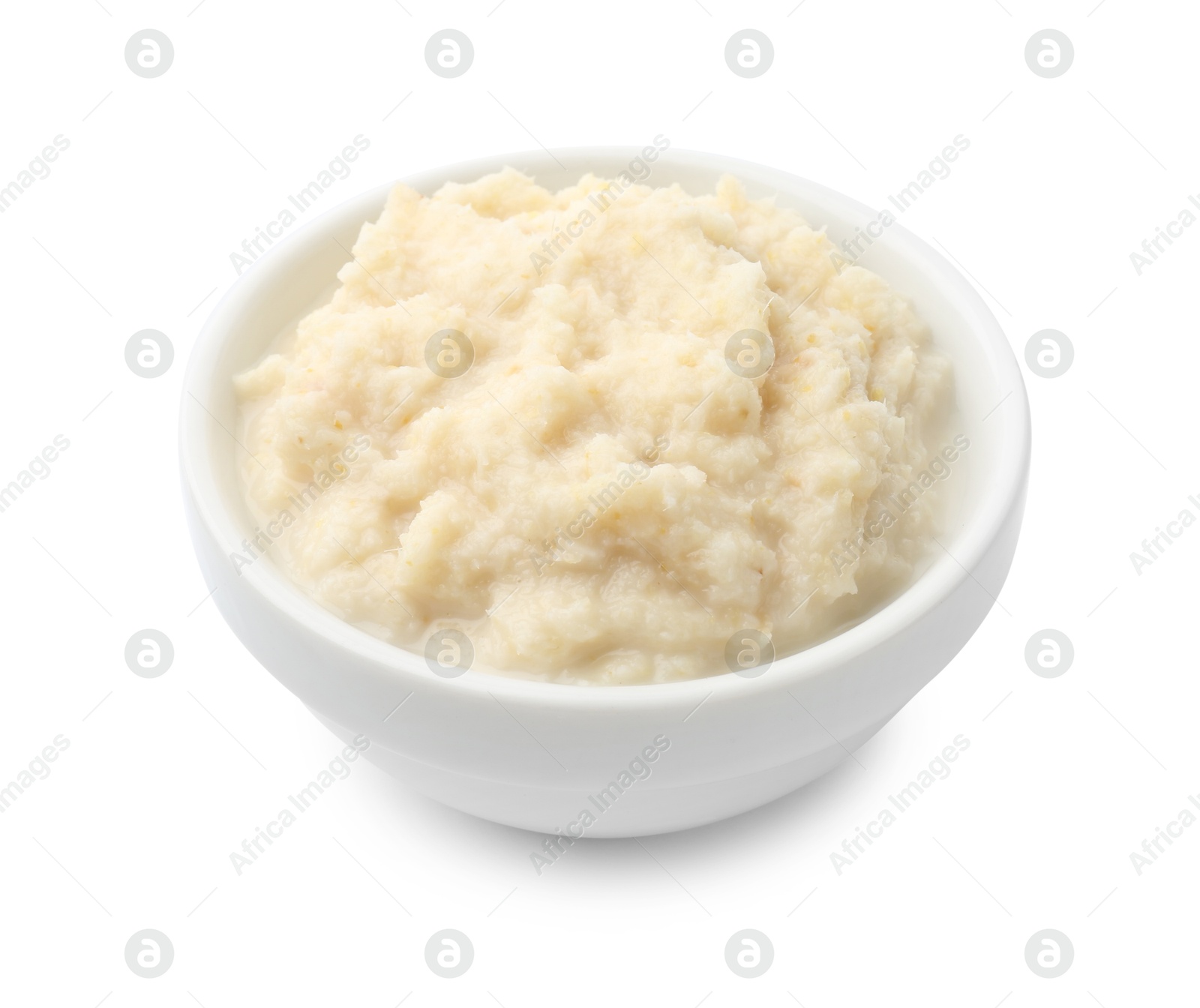 Photo of Tasty horseradish sauce in bowl isolated on white