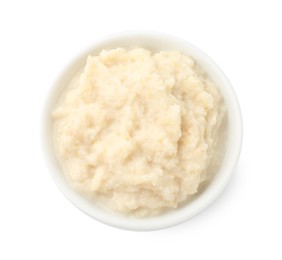 Photo of Tasty horseradish sauce in bowl isolated on white, top view