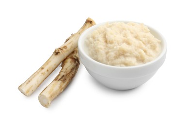 Photo of Tasty horseradish sauce in bowl and roots isolated on white